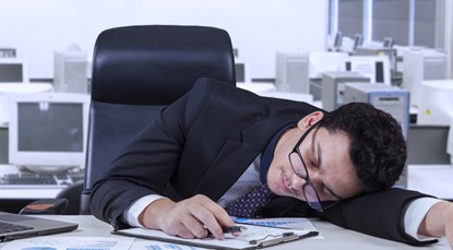 Business man sleeping on his desk