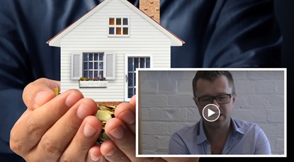 Hands holding house, JB video screenshot