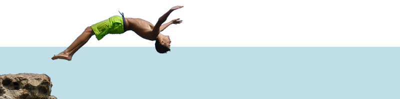 Boy doing back flip, in the air