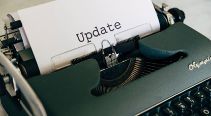 Typewriter with paper which says 'Update'