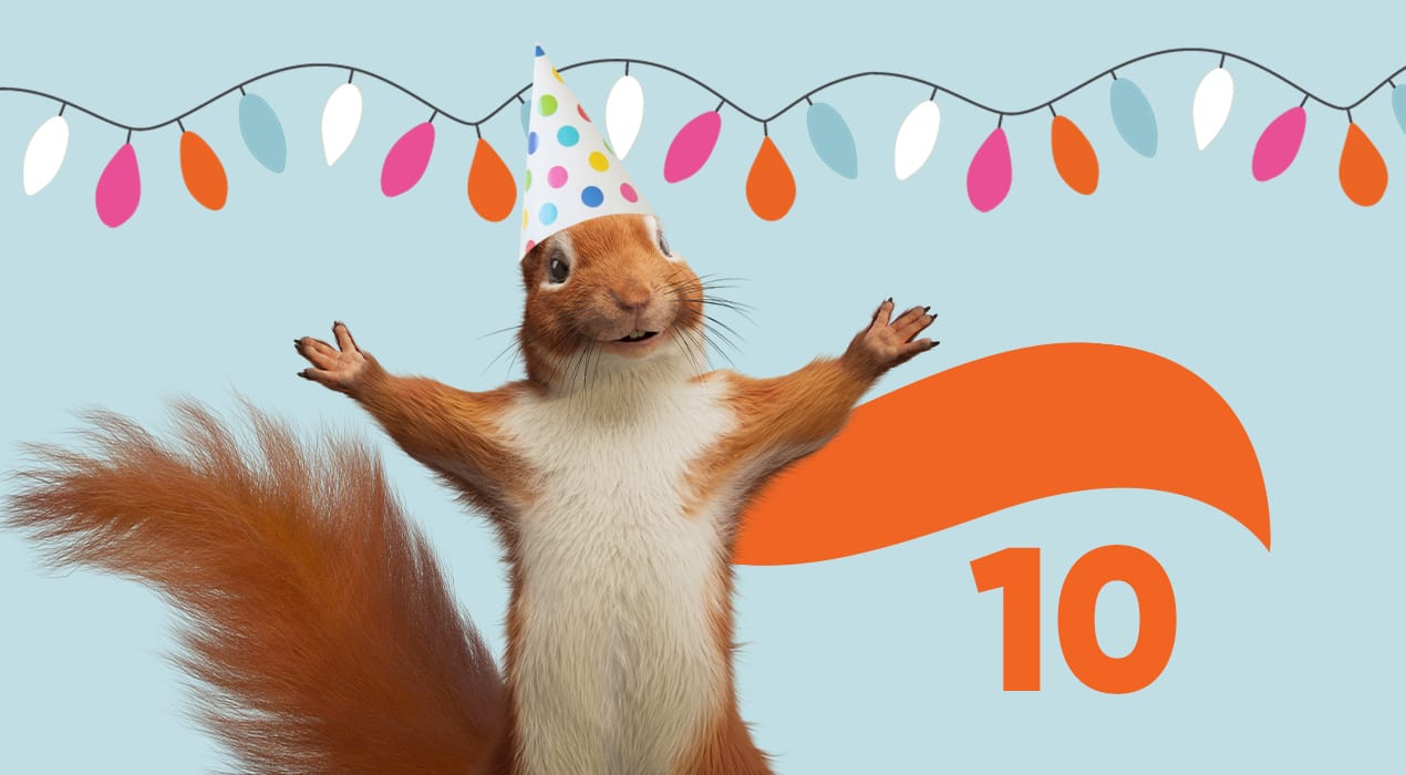 Bernie the Squirrel wearing a party hat, with the Squirrel squoosh and the number 10 in the background
