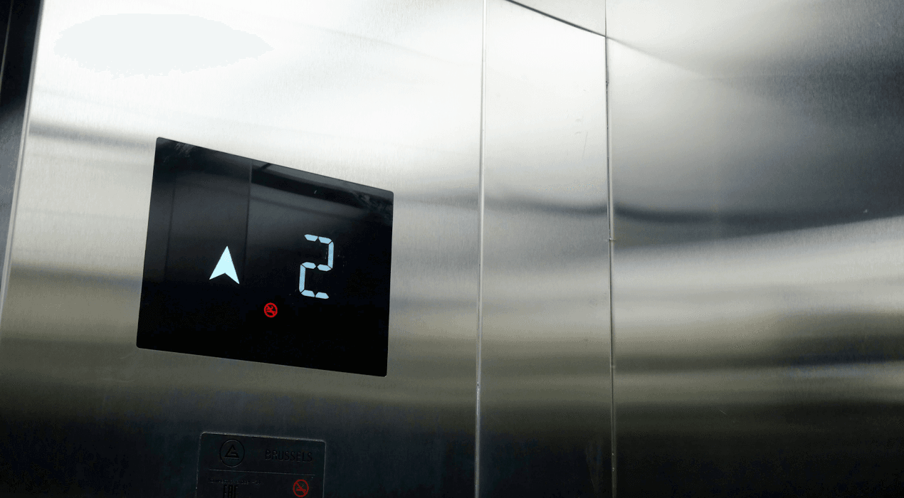 Close-up of a screen inside a lift showing it's on the second floor, going up