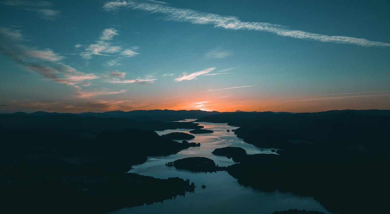 Sunrise over a river landscape.
