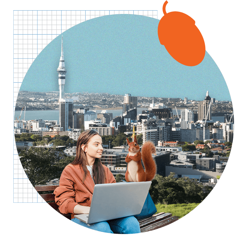 Women sitting on park bench with laptop looking over at Squirrel. Auckland skyline in background.