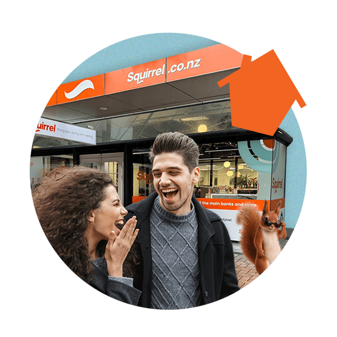 Two people laughing with each other with hair blowing in the wind, walking past Wellington Squirrel building. Squirrel popping out from the right hand side.