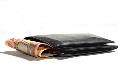 Black wallet with money popping out