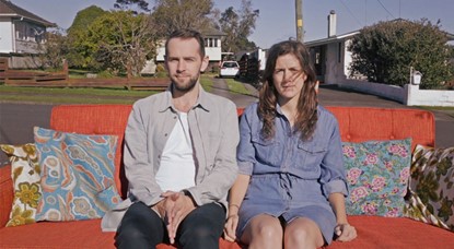 Young couple on couch, first home buyers