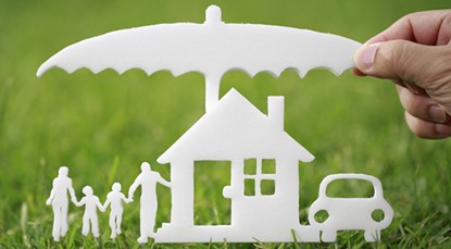 Cutout of family, house & car under umbrella