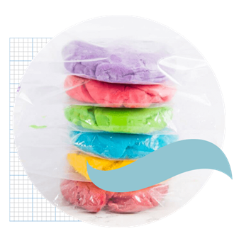 Different coloured playdough, stacked on top of each other