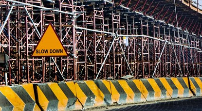 Construction site with Slow Down sign