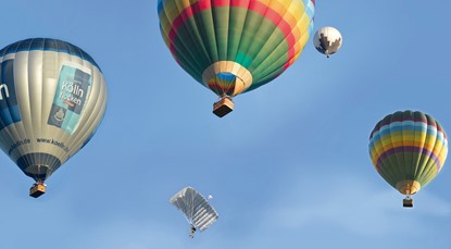 Hot air balloons rising in the air