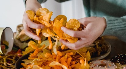 Hands holding crunchy chips