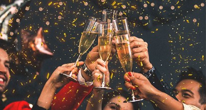People celebrating, raising champagne glasses