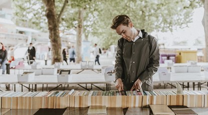 Young man browsing books at a market