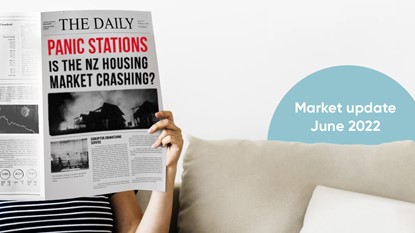 Person sitting on couch reading newspaper with headine reading "Panic stations: Is the NZ housing market crashing?"