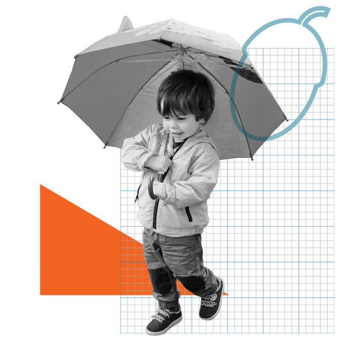 Young boy holding umbrella